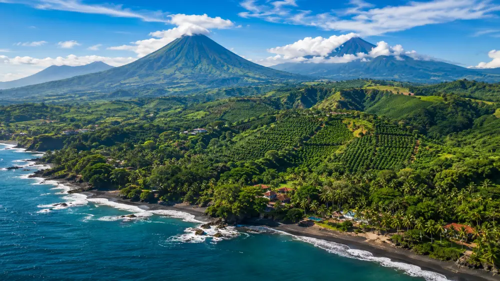 Aerial view showing El Salvador's diverse geography from beaches to volcanic mountains