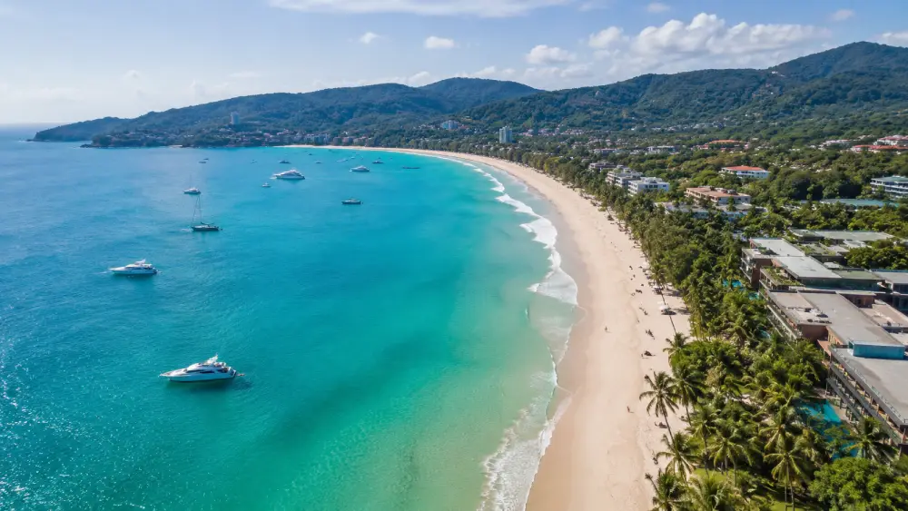 Aerial view of luxury resorts lining Kata Beach in Phuket.