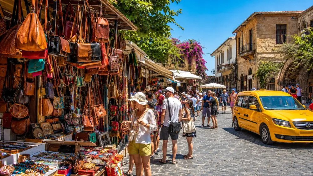 A bustling open-air market in Northern Cyprus showing colorful stalls.