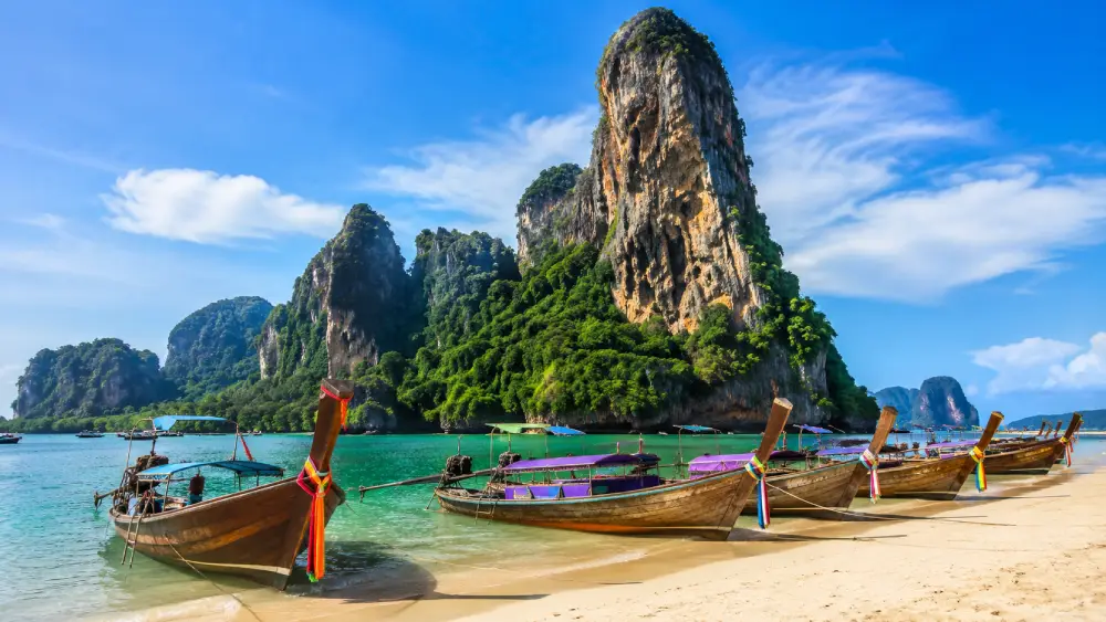 Dramatic limestone cliffs over the ocean at Railay Beach in Krabi.
