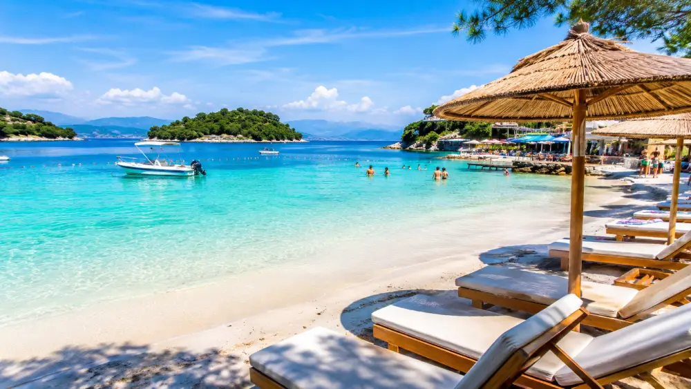 Shallow turquoise waters and pristine white sand beaches of Ksamil, Albania.